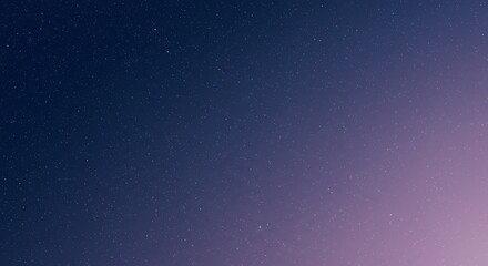 Obraz premium A tranquil and expansive cosmic gradient background, transitioning smoothly from deep midnight blue to a soft, ethereal violet, creating a serene and captivating celestial night sky ambiance.