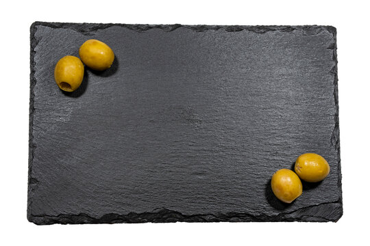 fotografía en formato png de cuatro oliva rellena de anchoas dos en cada esquina sobre un plato de pizarra negra