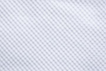  close-up of a white woven fabric, showcasing its delicate, uniform texture and subtle shadows.