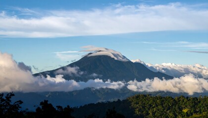 Majestic Mountain Peak Shrouded in Morning Mist and Clouds