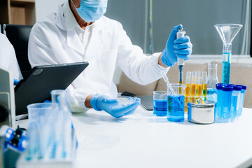 Scientist team meeting and writing analysis results in the laboratory study and analyze scientific sample