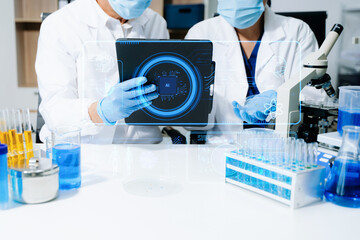 Medical technology, doctor use AI robots for diagnosis and increasing accuracy patient treatment in future. doctor hand working with tablet, computer with his team Medical research to improve patient