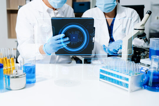 Medical technology, doctor use AI robots for diagnosis and increasing accuracy patient treatment in future. doctor hand working with tablet, computer with his team Medical research to improve patient