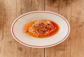 plate of risotto on a table in a street cafe