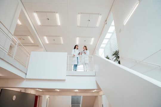 Medical team of doctors meeting in modern hospital interior