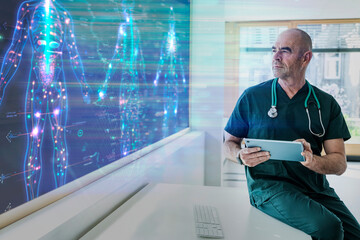 Doctor with tablet analyzing holographic anatomy screen in modern hospital