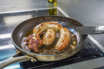 Danish national dish, organic pig medister sausage, fried with organic butter in a pan