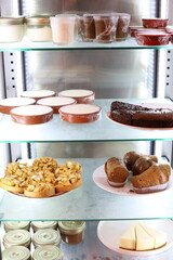 A view of a fridge full of desserts. Paris, France - August 14, 2025.