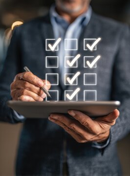 A professional individual, meticulously reviewing a digital checklist on a tablet, ensuring tasks are completed effectively, demonstrating attention to detail