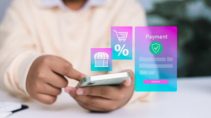 Person using smartphone with holographic online payment form, shopping cart, and discount icons, representing e-commerce, mobile shopping, and secure digital transactions.