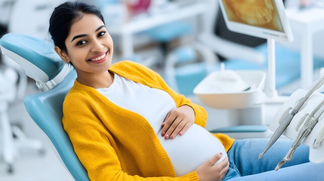Pregnant woman smiling while sitting in dentist chair