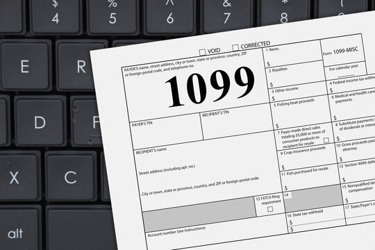 Federal tax 1099 form with a computer keyboard