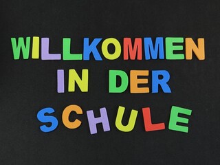 Obraz premium Multicolored eva foam letters form the expression in German 