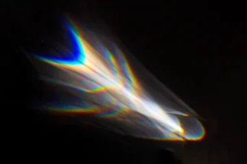 Water texture shadow with rainbow refraction of light on a black backgound. Overlay effect © Androlia