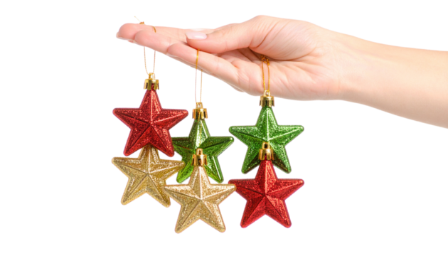 hand displaying colorful star-shaped Christmas toys on fingers isolated against a transparent background emphasizing holiday decorative themes isolated on transpaent background