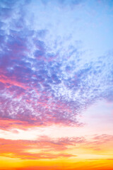 Beautiful , luxury soft gradient orange gold clouds and sunlight on the blue sky perfect for the background, take in evening,Twilight, Large size, high definition landscape photo,Vertical