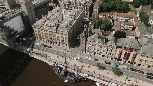 Newcastle upon Tyne: 24th July 2025: Nao Victoria ship docked at Tyne Quayside with city backdrop and visitors exploring the historic vessel. Drone footage