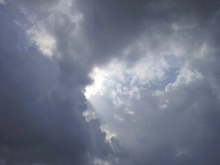 Fototapeta premium Sunlight Breaking Through Dark Storm Clouds
