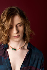 Handsome young man showcases modern fashion with flair and confidence in a stylish setting