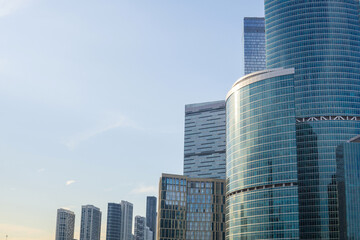 Obraz premium urban background with copy space, modern skyscrapers on a blue sky background