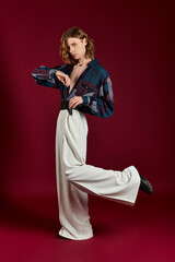 Dynamic fashion expression from a strikingly handsome young man in stylish attire