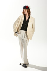 Innovative fashion exploration by a handsome man in a stylish ensemble under bright studio lights