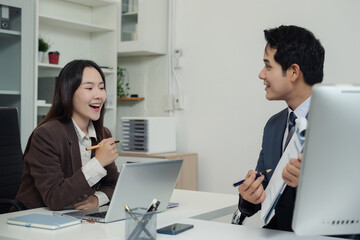 Fototapeta premium Asian business team collaboration, office project review or strategy meeting.