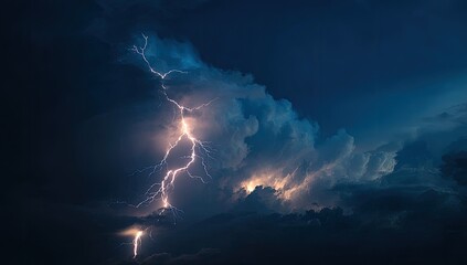 Dramatic storm clouds with intense lightning.  A powerful bolt of lightning illuminates dark, thick clouds