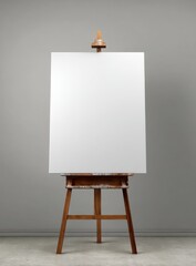 A blank canvas stands ready on a wooden easel, inviting creative expression and artistic exploration in a studio setting.