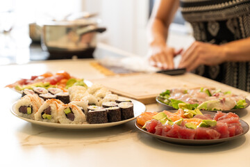 Freshly Prepared Sushi and sashimi with Colorful Ingredients on a Kitchen Counter
