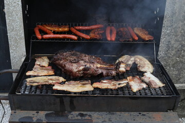 Essonne, France. August 2025. A close-up of some grilled meats on a barbecue.
