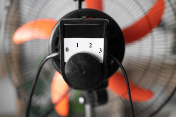 Close up of switch on electric floor fan