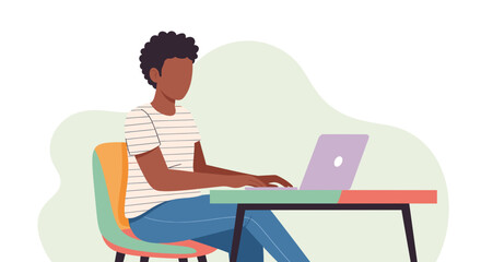 A young African American man sits at a desk typing on a laptop, focused on his work in a modern, minimalist workspace.