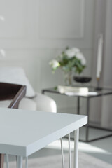 A bright and stylish interior, a table corner in the interior, a mockup for your product or text, a template or background for your content