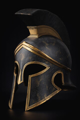 Ancient Greek warrior helmet with gold detailing on black background
