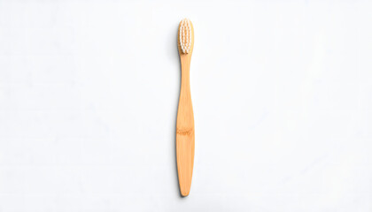A single, eco-friendly bamboo toothbrush with white bristles on a white background