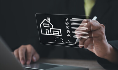 Businessman signing digital real estate contract on virtual interface, representing property...