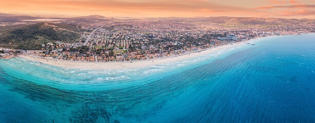 Capturing a stunning aerial panorama showcasing a sandy beach, vibrant turquoise waters, and a...