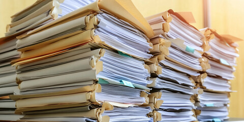 Stacks of bundled documents in an office setting Generative AI
