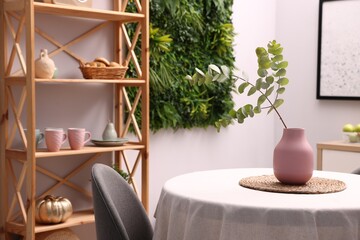 Stylish table with chair and decor in dining room. Interior design