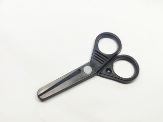 Black plastic scissors toy with white background