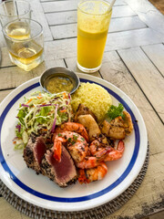 Colorful seafood medley with tropical zest, evoking Balinese Nyepi tranquility and Diwali's vibrant fusion of Eastern flavors