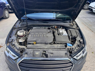 Sleek car engine exposed, mechanical symphony humming, celebrating National Mechanic's Month, fusion of technology and craftsmanship