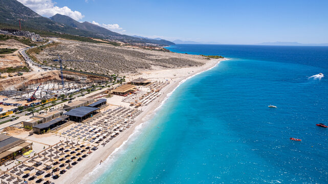 Aerial view of beach clubs along the Himare Albanian Riviera coastline on the Ionian Sea in southern Albania beside vlore.