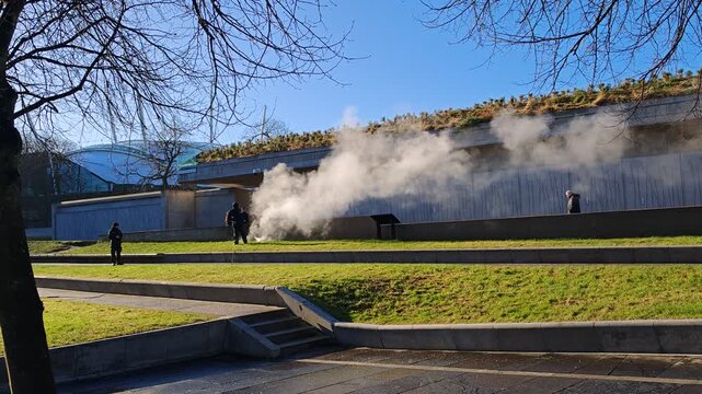 Cleaning concrete public walls with hot high-pressure steam in Edinburgh.