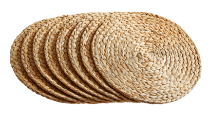 Stack of natural woven round placemats, adding rustic charm to any dining setting for a cozy meal isolated on white background 