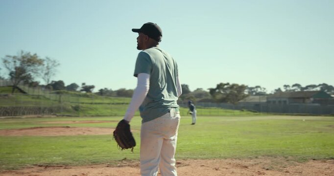 Runner running to first base as male fielder catching throw with glove bumping teammate on infield