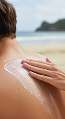 Fototapeta premium Woman putting sunscreen on man's back at sunny beach. Summer skin protection concept. Vacation and travel health.