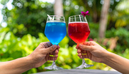Two artistic glasses with red and blue alcoho