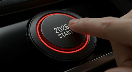 Human finger pressing 2026 start button with red neon circular interface on modern black control panel surface